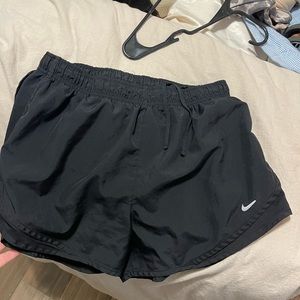 Black Nike running shorts